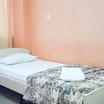 Кровать в 4-местном общем номере в Smart Hotel Kdo Пенза