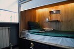 Кровать в общем 8-местном номере для мужчин и женщин в M&DHost