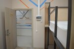 Кровать в четырехместном номере для мужчин в Триумф