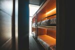 Кровать-капсула в четырехместном номере для женщин в Say Wow Capsule Hotel