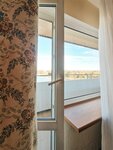 Двухместный  номер Бизнес с двумя односпальными кроватями и балконом в Балтика