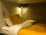 Спальное место 110/200 на 2 ярусной кровати в 10 местном общем номере для мужчин и женщин в VDali Poshtel