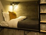 Спальное место 90/200 на 2 ярусной кровати в 10 местном общем номере для мужчин и женщин в VDali Poshtel