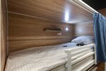Кровать в просторном 10-и местном общем номере в Roomy Hostel