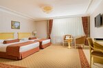 Номер первой категории СУПЕРИОР ТВИН (вид на стену) в Rimar Hotel Krasnodar