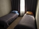 Односпальная кровать в общем номере в Виктория