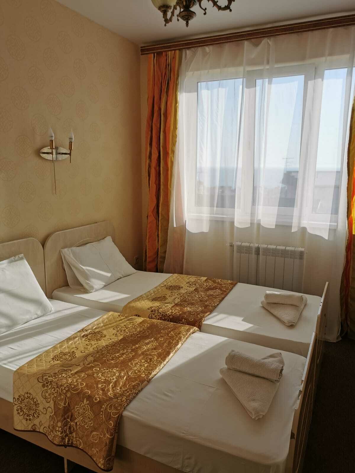 Двухместный номер с 2 отдельными кроватями и ванной