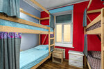 Спальное место на двухъярусной кровати в общем номере для мужчин и женщин в Тепло Северной Столицы