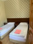 Двухместный номер эконом-класса с 1 кроватью или 2 отдельными кроватями в Лора