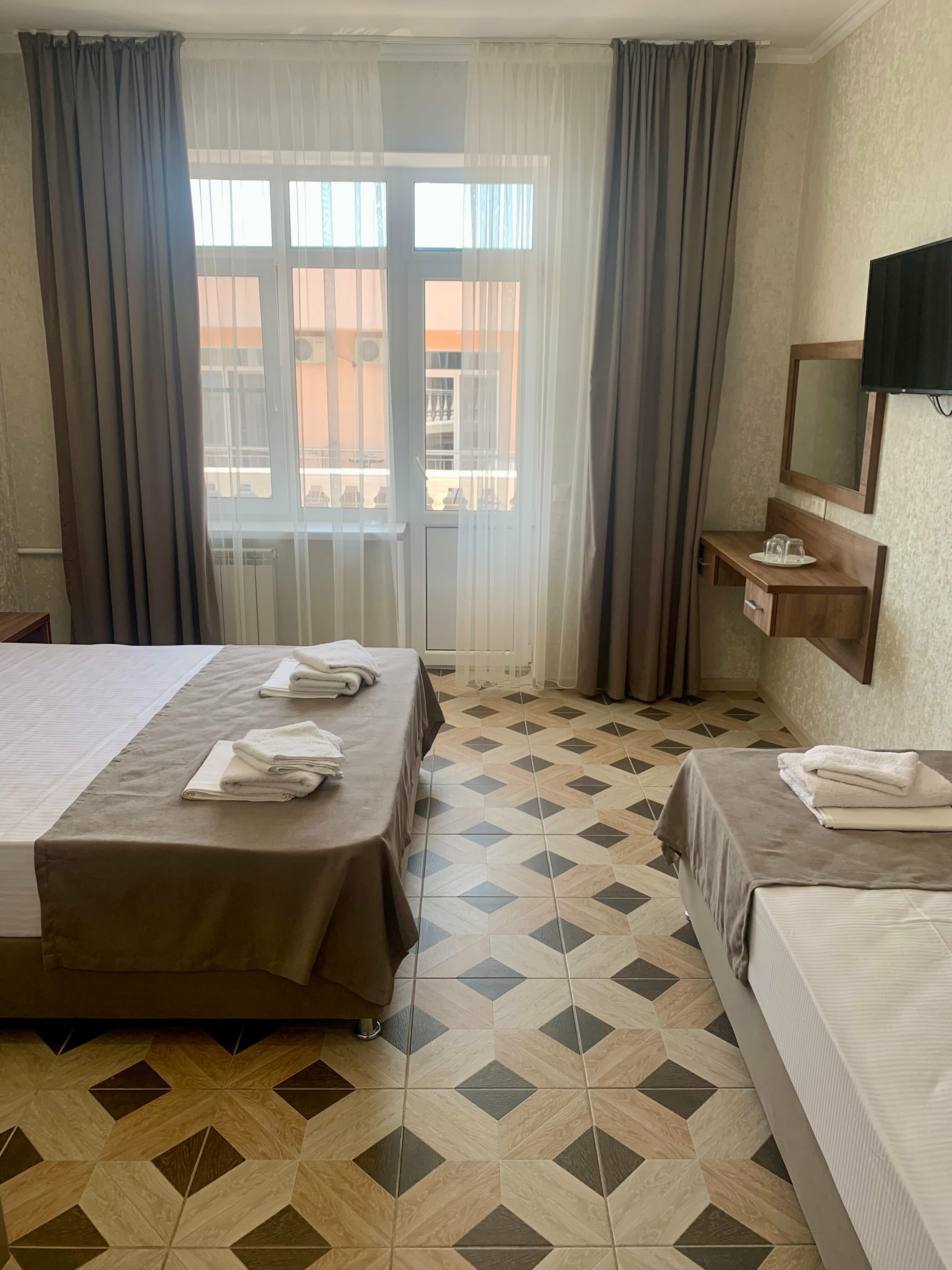 Трехместный номер Делюкс