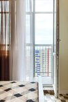 Классические Апартаменты с балконом с панорамным видом (на ул. Павлюхина 110 В) в KazanHome
