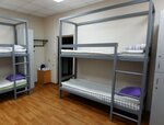 Спальное место на двухъярусной кровати в общем номере для мужчин и женщин в Солнечный