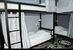 Спальное место на двухъярусной кровати в общем номере для мужчин в Melius