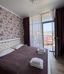 Улучшенный четырехместный номер в Family House