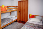 Спальное место на двухъярусной кровати в общем номере для мужчин и женщин в Вагон