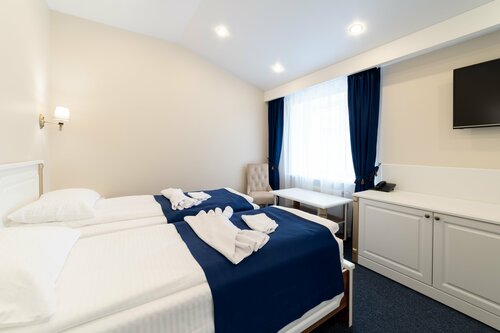 Просторный двухместный номер с 2 отдельными кроватями