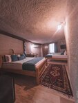 Трехместный номер, нет вида, первый этаж (Cave) в Local Cave House Hotel