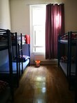 Общее спальное помещение (Bed in 8 mixed dorm) в Saint James Backpackers