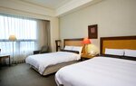 Стандартный четырехместный номер в Hotel Les Champs Jiaosi