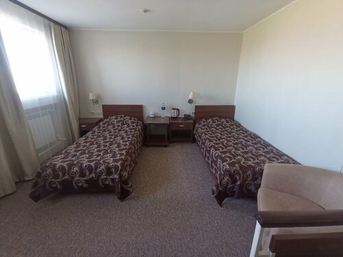 Двухместный номер с 2 отдельными кроватями и общей ванной комнатой в Досуговый клуб Олимп