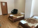 Кровать в общем номере с двумя кроватями в Парнас