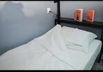 Спальное место на двухъярусной кровати в общем номере для мужчин в Melius
