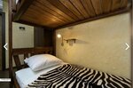Спальное место на двухъярусной кровати в общем номере для мужчин и женщин в Бамбу