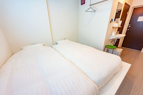 Номер с 2 односпальными кроватями, для некурящих в Plat Hostel Keikyu Sapporo Sky
