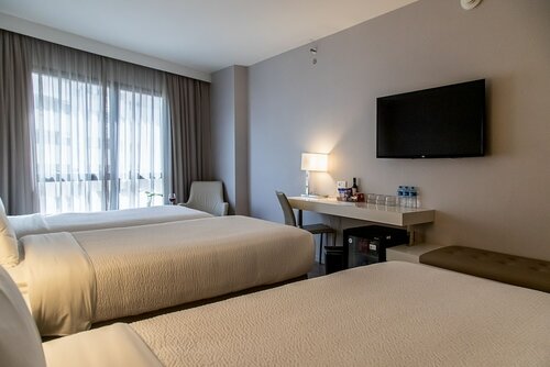 Quarto Superior Triplo Twin в Radisson Barra Rio De Janeiro