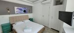 Трехместный номер «Делюкс», вид на город в Tenes Otel