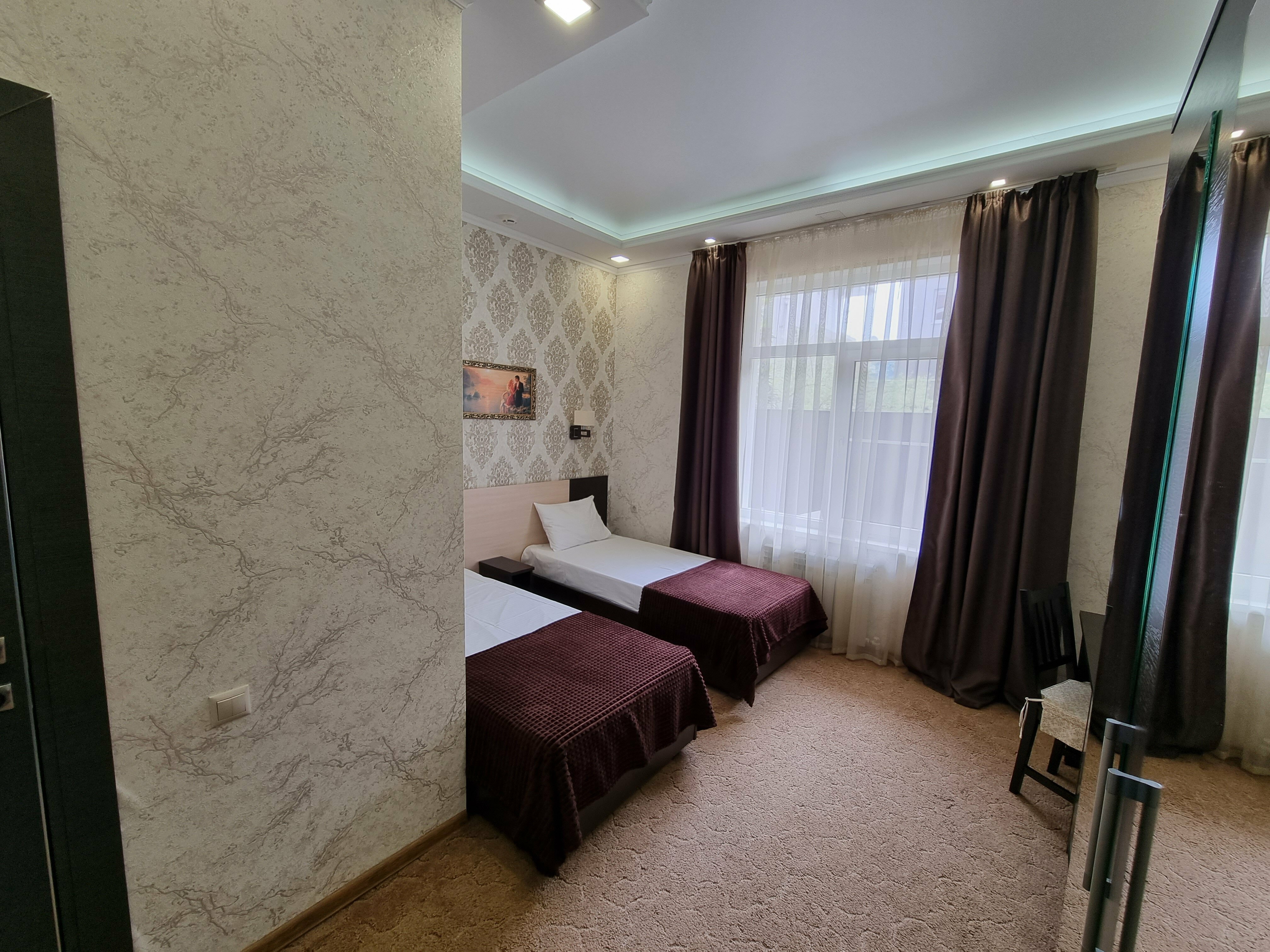 Двухместный номер с 2 отдельными кроватями и душем