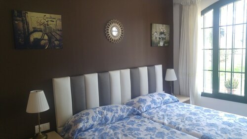 Улучшенный двухместный номер с 1 двуспальной кроватью, 2 односпальные кровати, вид на сад в Hospederia V Centenario