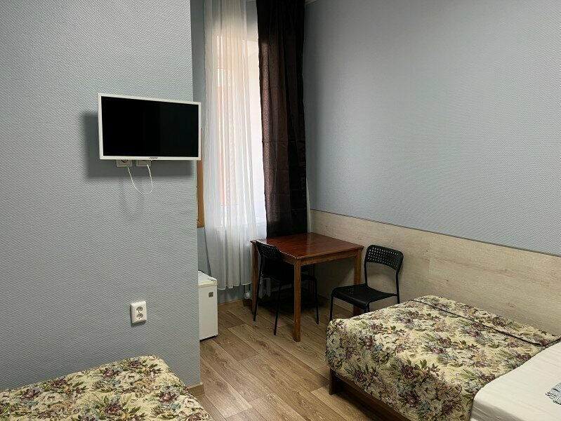 Двухместный номер с 2 отдельными кроватями и общей ванной комнатой