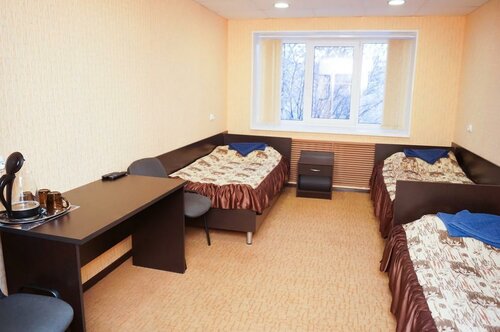 Кровать в 3-местном общем номере в Зори