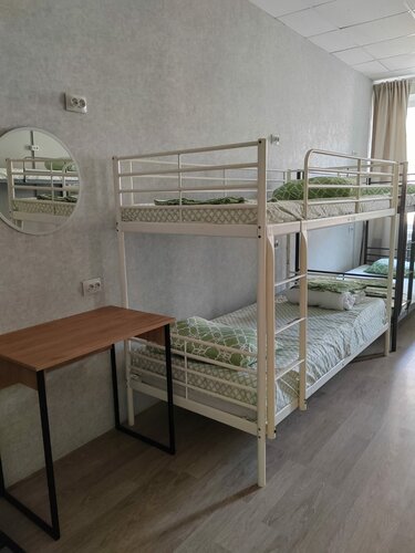 Спальное место на двухъярусной кровати в общем номере для мужчин