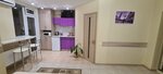 "Стандарт Фиолетовый" с балконом  с двуспальной кроватью и-кухней Парковая 29 в Номера Парк-Отель