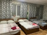 койко-место в 4-х местной комнате с четырьмя односпальными кроватями в Твой Отель