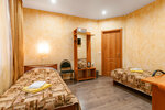 Стандартный двухместный номер с 2 отдельными кроватями и общей ванной комнатой в Старый Псков