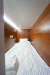 Спальное место на двухъярусной кровати в общем номере для мужчин и женщин в Точка притяжения