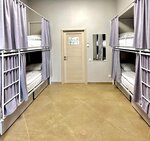 Спальное место на двухъярусной кровати в общем номере для женщин в Сова