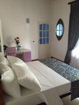 Трехместный номер в Ka Mario Guesthouse
