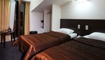 Стандартный двухместный номер с 2 односпальными кроватями, 1 спальня в Гостиница Каскад