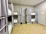 Спальное место на двухъярусной кровати в общем номере для мужчин в Сова