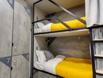 Спальное место 110/200 на 2 ярусной кровати в 10 местном общем номере для мужчин и женщин в VDali Poshtel