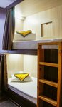 Кровать в общем 6-местном номере для мужчин и женщин в Hotel Loft Ptz