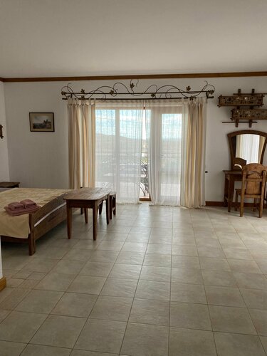 Люкс с балконом в Гостиный дом на Меганоме