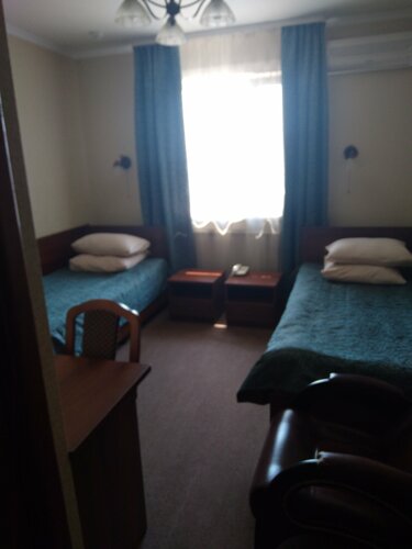 Двухместный номер с 2 отдельными кроватями и душем