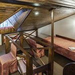 Одноместный улучшенный двухуровневый с балконом (двуспальная кровать) (с завтраком) в ЮрЛа