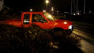 Isuzu TF Pickup driving over the bush
