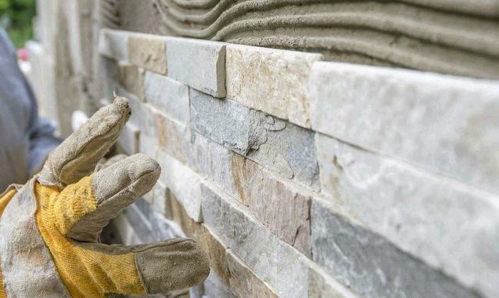 �������������� �������������������������� ����������, worker install stone wall surface with cement for house, ������������������ ��������������, �������������� ���������������������������� ����������, �������������� ������������